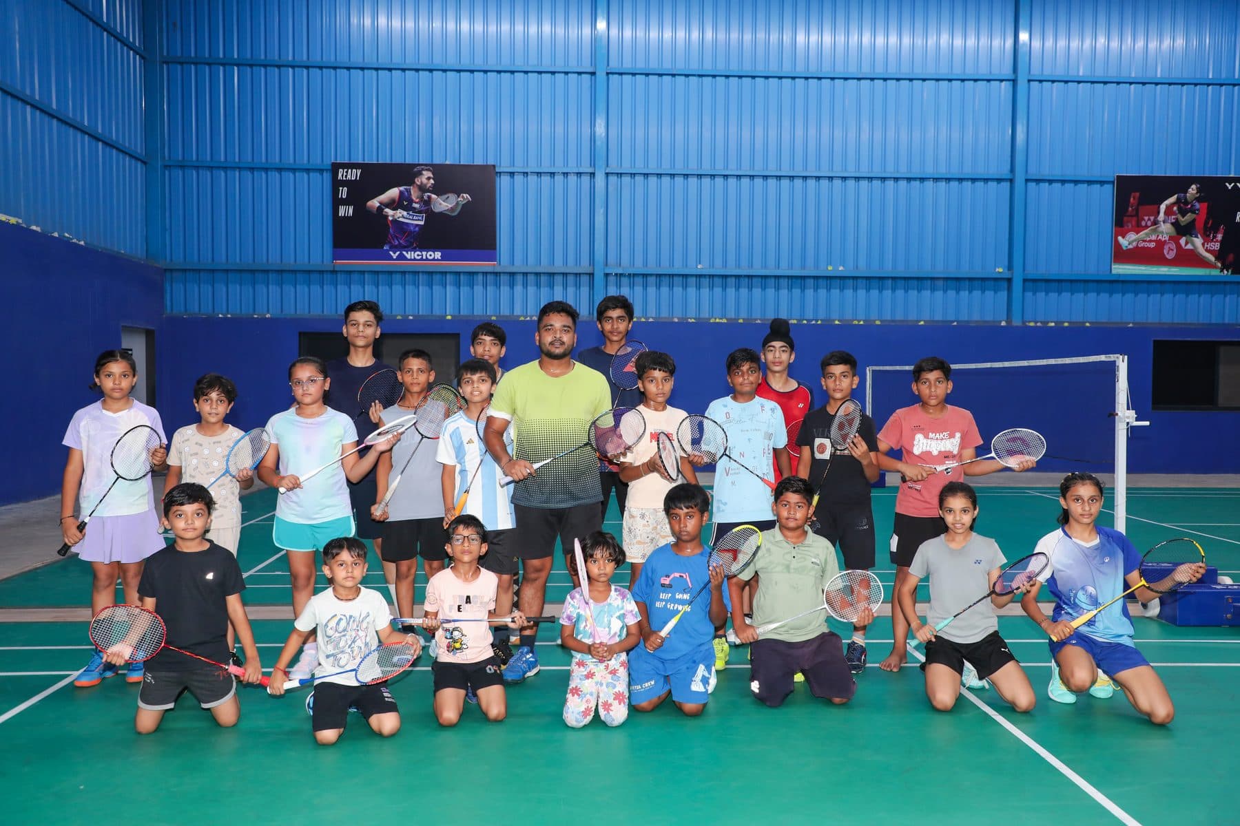 Axon Badminton Academy players and coach group photo