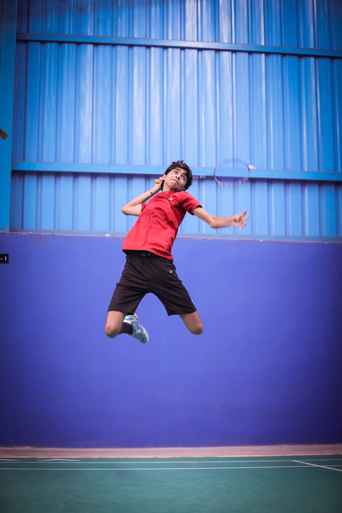 Axon player jumping for a smash